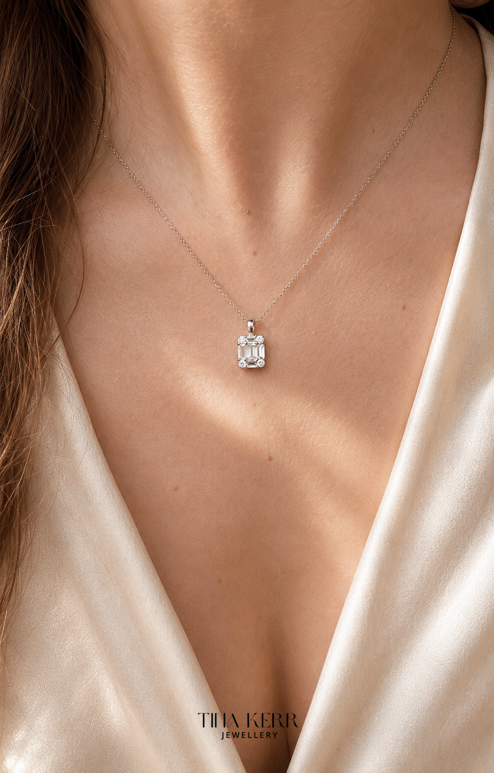 Necklace with a diamond pendant worn by a person, with 'Tina Kerr Jewellery' branding.